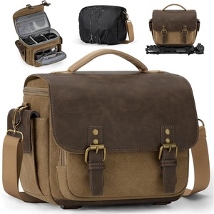 image:imageRAINSMORE Camera Bag Vintage Canvas Camera Sling Bag Small Waterproof DSLR SLR Mirrorless Crossbody Camera Case for Photographers with Rain Cover amp Tripod Holder for Sony Canon Nikon Fujifilm KhakiKhaki